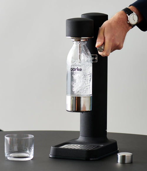 Aarke PET water bottle making sparkling water with the Carbonator 3