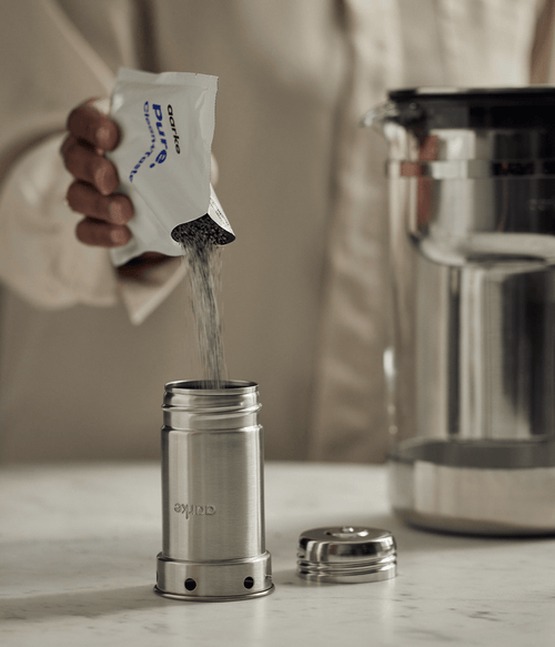 Pure filter granules poured into refillable filter cartridge